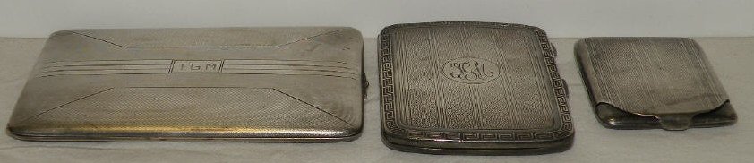 Collection of English Sterling Silver Cases: Collection of sterling silver match, card and bill fold cases. Two are hallmarked for sterling with British marks. One apparently unmarked. Art Deco & Greek Revival design motifs. Largest measures 4.5