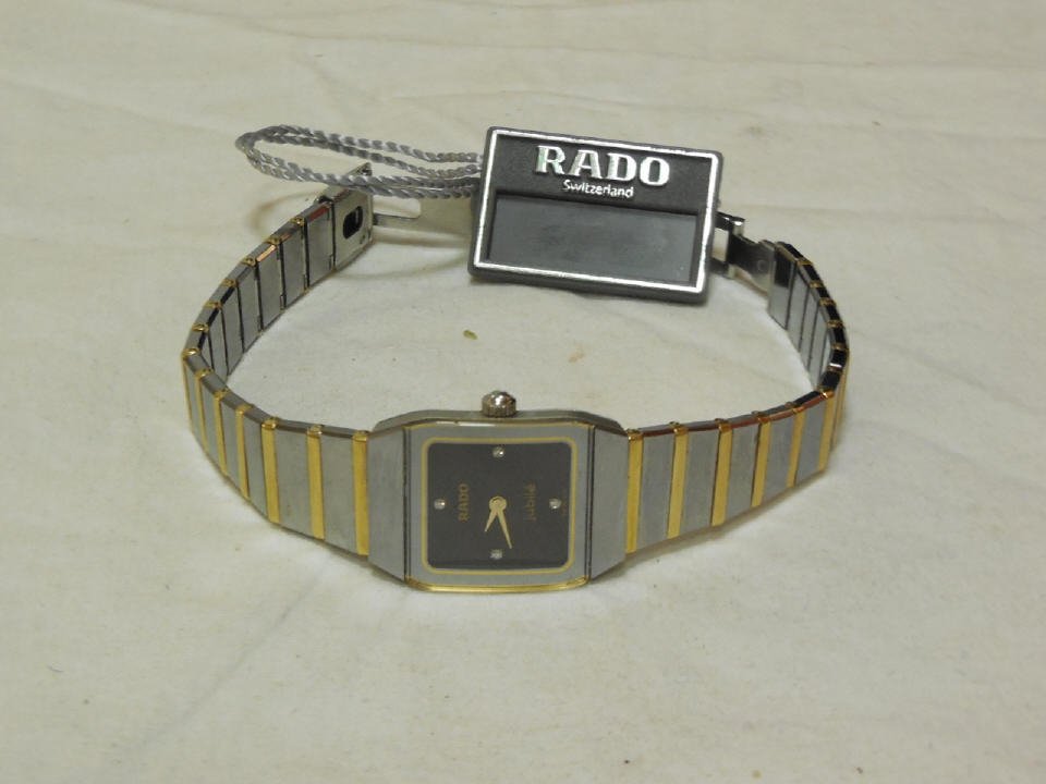 New in Box Rado Jubilee Ladies' Watch: NEW in box Rado Jubilee ladies' watch, item number R1036751. Swiss quartz, sapphire crystal scratch resistant, four diamonds (.011carats), pull and push crown, water resistant up to 30 meters., 6mm th