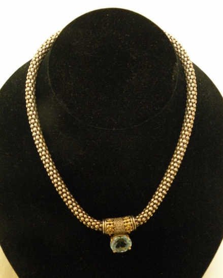 David Yurman Style Sterling Silver Necklace: Sterling silver and 14K gold choker necklace. In the style of David Yurman. Pave diamond accent with blue gemstone pendant. Weight approximately 45.3 grams. (including stones). 16" long. In very good 