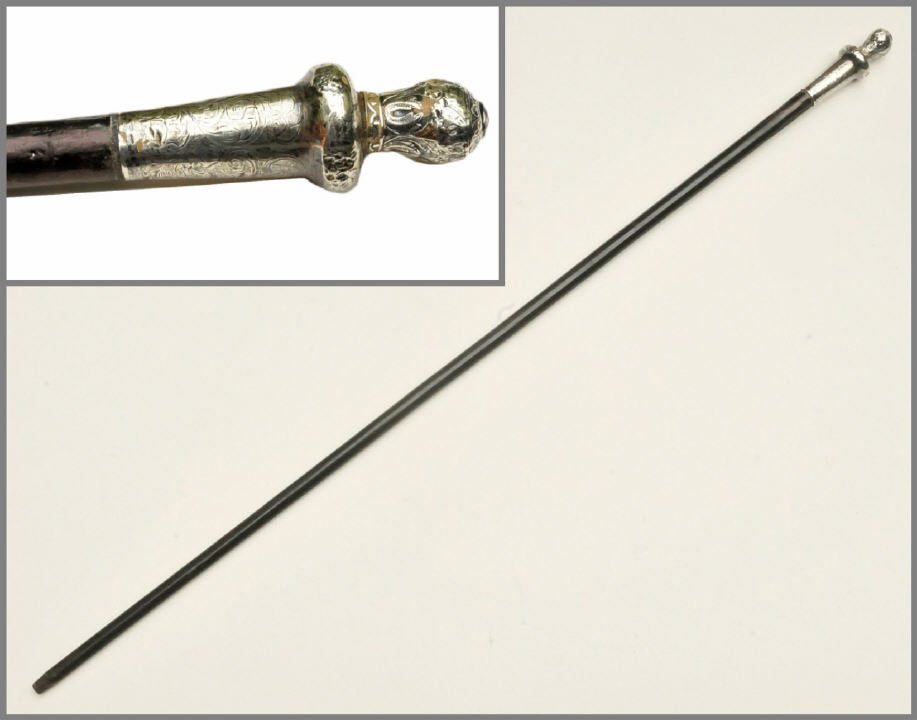 Antique British Walking Stick w Horseshoes: Antique 38" long British walking stick with a very ornate hallmarked handle head with embossed horseshoes and other embossed designs and an enamel painted black background that is partial due to age w