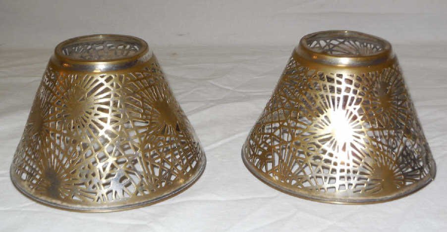 Tiffany Studios Pine Needle Lamp Shade: Tiffany Studios candle lamp shade, decorated with the pine needle pattern. Gilt brass. Stamped "Tiffany Studios", "New York". Circa 1900. 5 1/2" diameter x 3 1/2" slant. Very good original condition. 