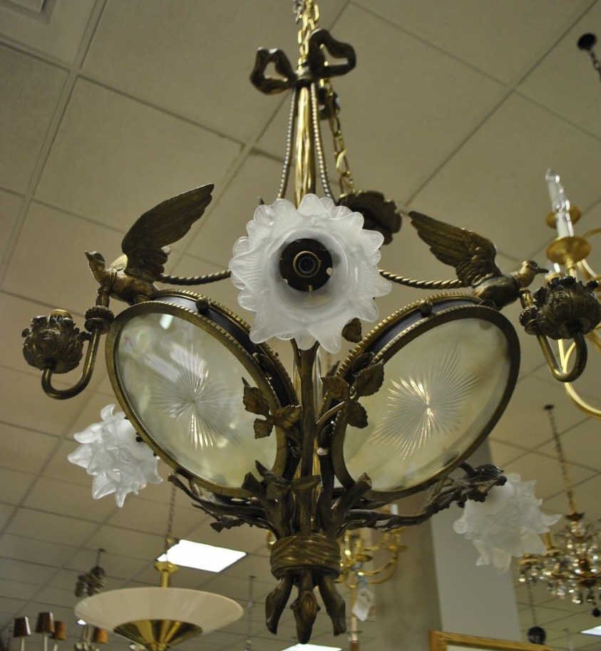 Antique French Rococo Gilt Bronze Glass Chandelier: Antique ornate French Rococo style gilt bronze ormolu and frosted glass chandelier. Having design components including birds, tree branches, ropes, ribbons and acanthus leaf gilt bronze details. Candl