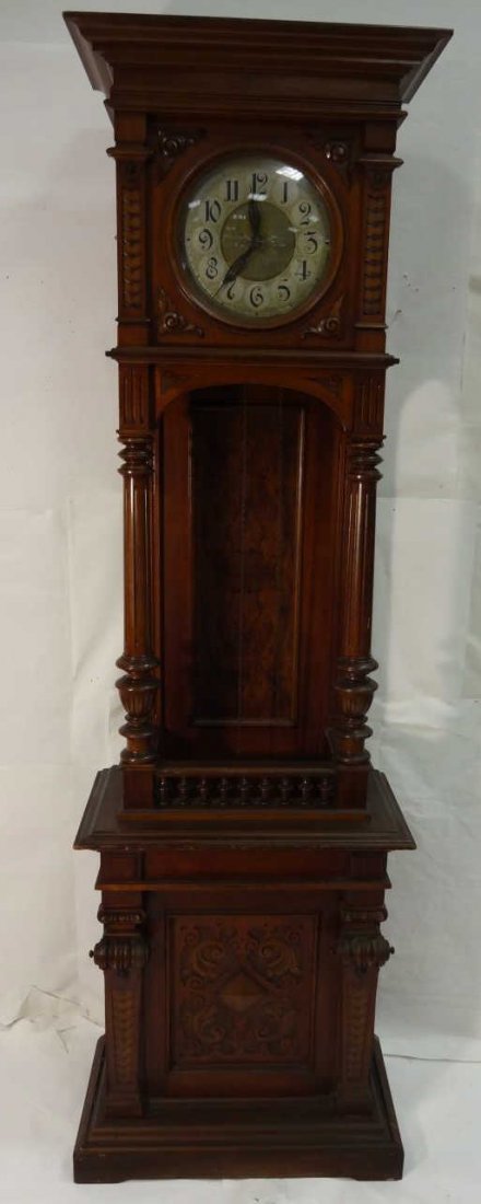Antique German Crotch Mahogany Grandfather Clock: A German mahogany and crotch mahogany grandfather clock, 25 3/4" W x 13 3/8" D x 81" H. Very good condition.
