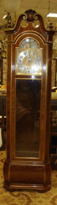 Herschede Mahogany Grandfather Clock Model 250: Herschede mahogany grandfather hall clock, model #250. The Clock" . Manufacturer date: 1968. Mahogany wood with acacia burl veneers. Attached strip brass detail. Gold plated dial, brass weights, 9 tub