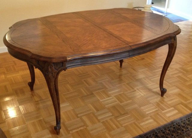 French Country Provencial Style Dining Table: French country provencial style carved wood dining table. Having cabriole legs, additional leaves and custom made table cover.