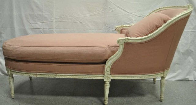 Upholstered Chaise Lounge, Antique White Frame: Chaise lounge, antique white painted frame, upholstered in pink cotton fabric, loose throw pillow. 26" W x 68" long x 33" H. In excellent condition.