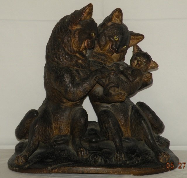 Large Terracotta German Glass Eye Cat Statue: Large terracotta German or possibly Austrian glass eye cat statue. Family of cats on base. Hand painted. Late 19th century. Nice antique condition. Measures 17 x 18 x 12 inches.