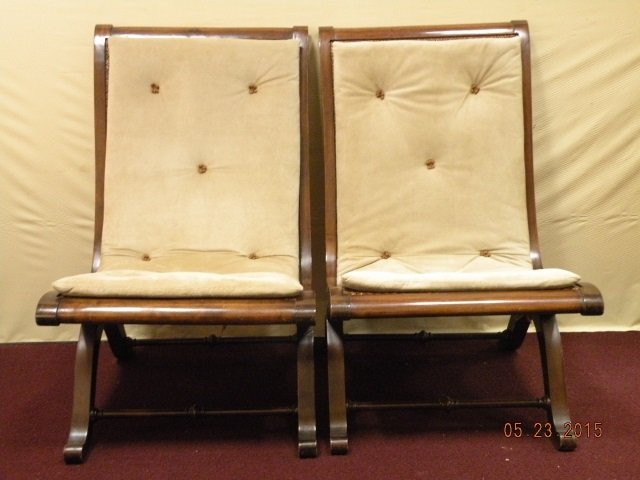 Pair of British Colonial Campaign Chairs: Pair of British Colonial Campaign chairs, cane and mahogany with beige suede cushions. Cushions are removable. (tied on in back) Tufted detail. 21 1/2" W x 26 1/2" D x 35" H. Seat height 17" at highes