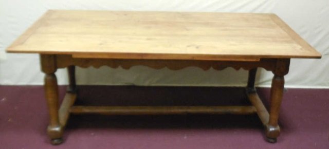 Antique French Style Oak Harvest Farm Table: Vintage oak harvest farm table with two 15" leaves. Carved shaped apron. Stretcher on bottom. 73 1/2" long x 34" D x 29" H. 103 1/2" long with leaves. In good vintage condition.