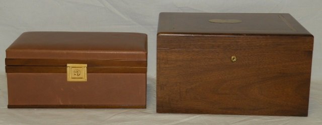 Lot of 2 Vintage Dunhill Humidors: Lot of two vintage humidors. Dunhill Brown leather with wood detail. Brass opener. Stamped "Dunhill Made in Italy" on bottom. 10 3/4" W x 6 1/2" D x 4 1/2" H. Larger (Not Dunhill) wood humidor has bra
