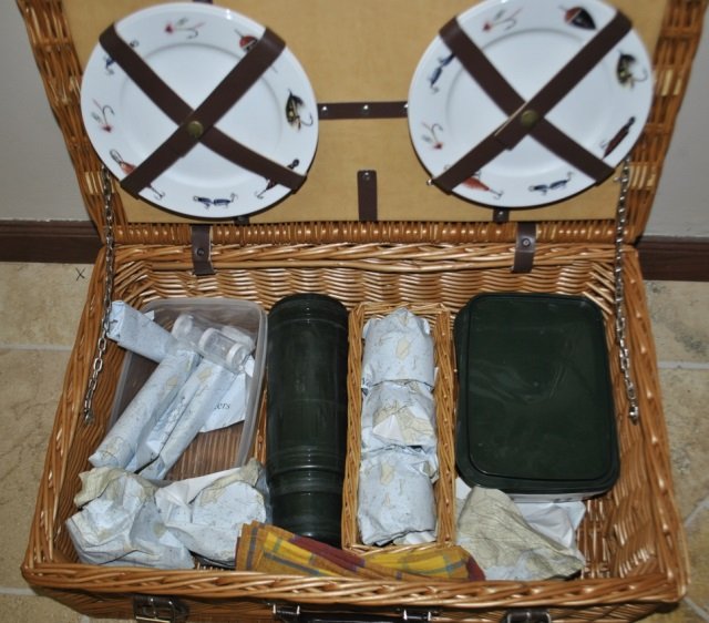 Vintage Picnic Basket w/ Service for Four: Vintage picnic basket with service for four. Porcelain plates, serving items, utensils. Basket measures 23 by 15 by 9 inches.
