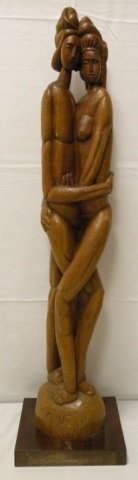 Gaspar Mario Cruz Carved Wood Sculpture Lovers: Gaspar Mario Cruz carved wood sculpture, "Lovers". Signed by the artist, Cruz. Born 1925-2006 in the Dominican Republic. 11 1/2" W x 11 1/2" D x 47" H. In good condition.