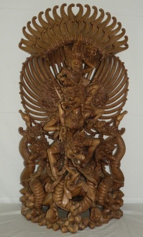 Balinese Carved Wood Garuda Sculpture: Balinese wood Garuda sculpture. Very intricately carved. 16" W x 12" D x 34" H. In very good condition. A tip of a feather on top left is chipped off.