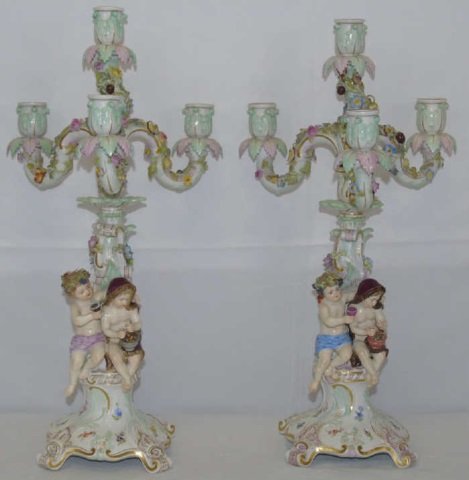 Large Antique German Meissen Rococo Style Candelabras: Large antique German Meissen Rococo style ornate porcelain candelabras with flowers, leaves, Bacchanalia figures at base with wine. Gilt decorations overall. Minor losses but nice condition overall fo