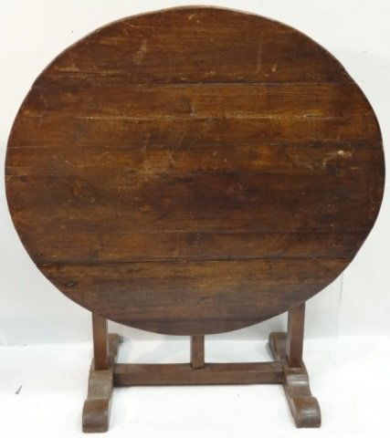 Antique Mahogany Circular Tilt-Top Table: Antique mahogany circular tilt-top table. 40" L x 36" W x 27 1/4" H, good used condition with some light wear and warping.