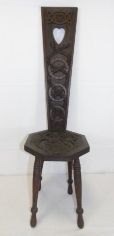 Antique Celtic Hand Carved Wood Chair: Antique Celtic Carved Wood Chair. Hand carved with four legs. Snake motif seat and back. Measures 40 inches in height, 14 inches deep, 12 inches wide.