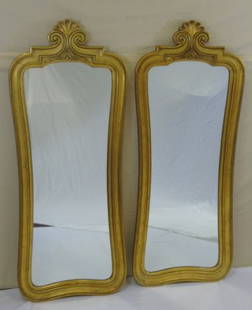 Pair Art Deco / Hollywood Regency Style Mirrors: Pair of mirrors, gold leaf finish. Scroll top detail. 20" W x 50" H. Good condition.