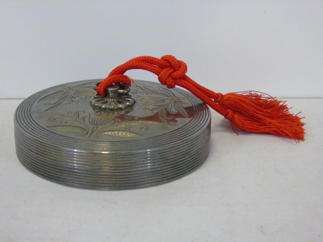 Vintage 950 Silver Powder Compact: Vintage 950 silver powder compact with fancy top and red tassel. 3 1/2" diameter x 3/4" H. 5.91 ounces. Good vintage condition.
