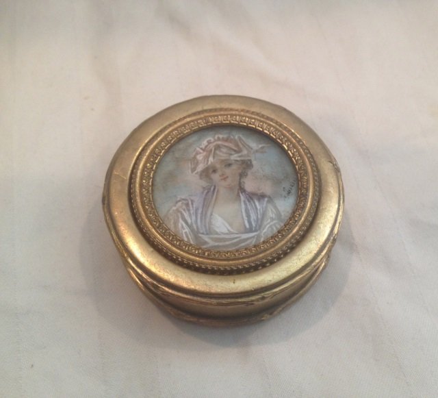 Antique French Portrait Miniature Ormolu Box: Antique French Portrait Miniature Ormolu Box. Gilt ormolu box with portrait miniature of a lady, signed. Stamped FRANCE. Measures 2 inches in diameter.