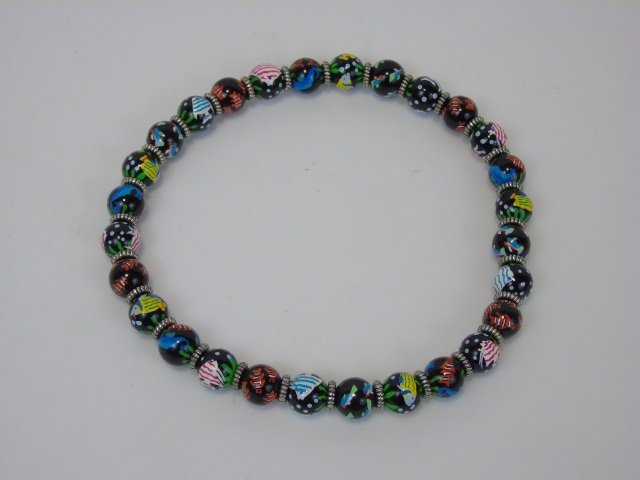 Angela Moore Hand Painted Bead Necklace w/ Fish: Angela Moore hand painted bead choker necklace. Black wood ball beads with mult-color fish. From Nantucket. Stretch elastic. One size fits all.