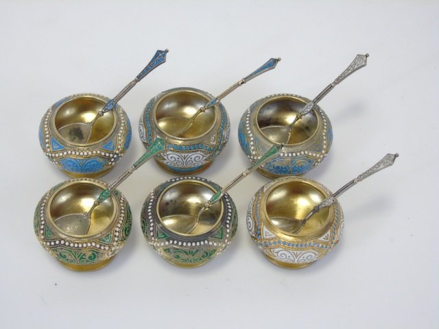 Six Russian Cloisonne Enamel Silver Salt Cellars: Six Russian Cloisonne Enamel Silver Salt Cellars. Six hallmark 84 for Russian silver, M for maker's mark, each having similar design and spoon. Gold wash over silver. Spoons each measure approximately
