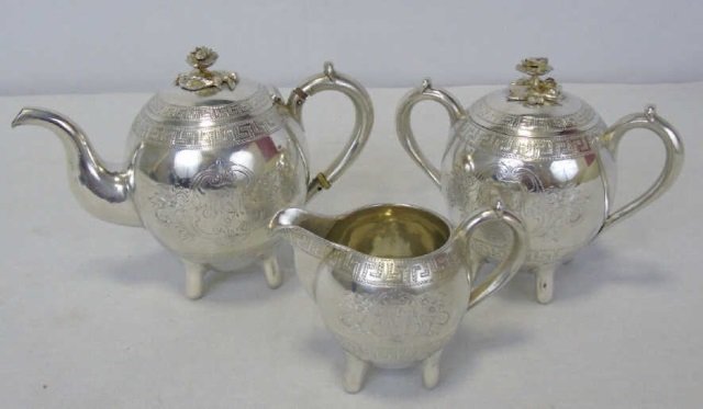 Antique Imperial Russian Sterling Silver Tea Set: Antique Imperial Russian Sterling Silver Tea Set. Hallmarked 84, maker's mark, dated in hallmark 1873, dated in inscription 1922. Gilt wash interior. Rose motif handles. Tea pot measures just under 6 