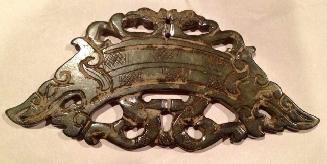 Large Chinese Jade Carving w/ Dragons: Large Chinese jade / hard stone carving with scrollwork and dragons on both sides. Measures 5 by 2.5 inches.