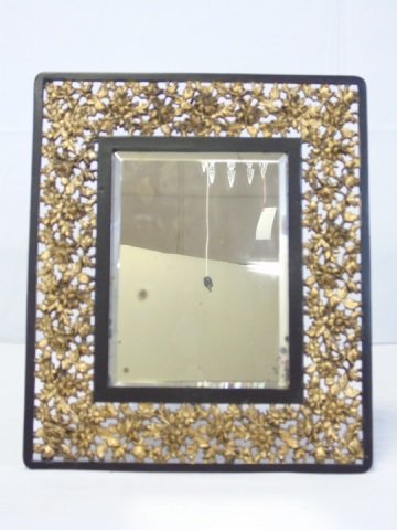 Antique 19th C Bradley & Hubbard Mirror: Antique 19th C Bradley & Hubbard Mirror. Gilt and ebony tone floral motif and frame. Measures 16.5 by 13.5 inches.