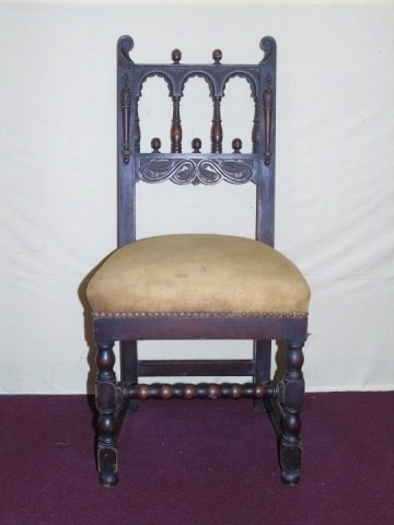 Antique Jacobean / Tudor Style Oak Side Char: Antique English Jacobean / Tudor style side chair with brass upholstery tack details around seat cushion. Measures 40 inches in height, 15 inches in width, 17 inches in depth.