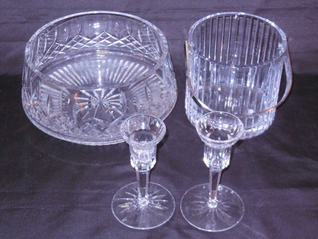 Lot of 4 Cut Crystal Pieces Inc. Waterford: A lot of four cut crystal pieces. A pair of Waterford candlesticks, 3 1/2" Dia. x 5 7/8" H. An ice bucket, 5 7/8" Dia. x 5 5/8" H. A bowl, 10 1/4" Dia. x 4 3/4" H. All in good condition.