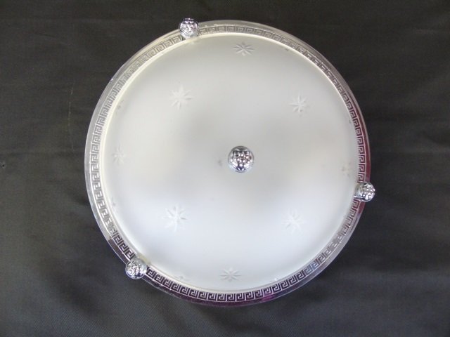 Vaughan Flush Mount Ceiling Light Fixture: Vaughan (in the D & D building) flush mount ceiling light fixture. Frosted glass with etched stars. Chrome back plate with Greek key motif. 11" diameter x 3" H. Good condition.