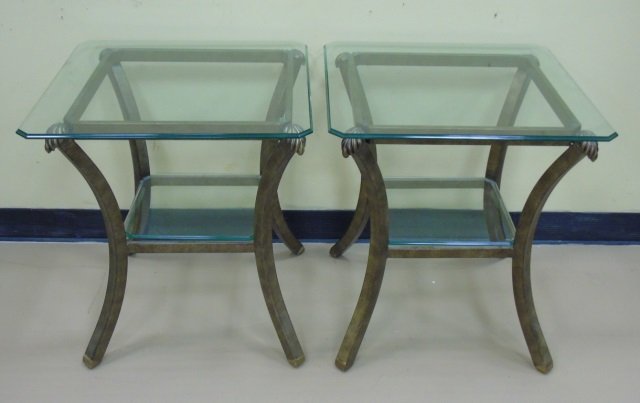 Pair of Iron & Glass Top End Tables Burnished Gold: Pair of iron and glass top end tables with burnished gold finish on base. Lower glass shelf. Leaf detail. 22 1/2" square x 24" H. Very good condition.
