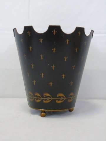 Black Tole Metal Waste Basket: Tole waste basket, black with gold decoration. Shaped top. Ball feet. 13" diameter x 13" H. Very good condition.