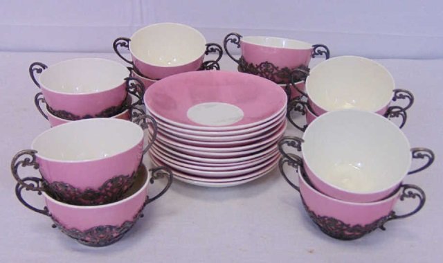 Antique English Sterling Silver Bouillon Cups: Antique English Sterling Silver Bouillon Cups. Hallmarked for English sterling silver. Mounted over pink porcelain. Cups and under plates. Saucer measures 5 1/2" diameter.