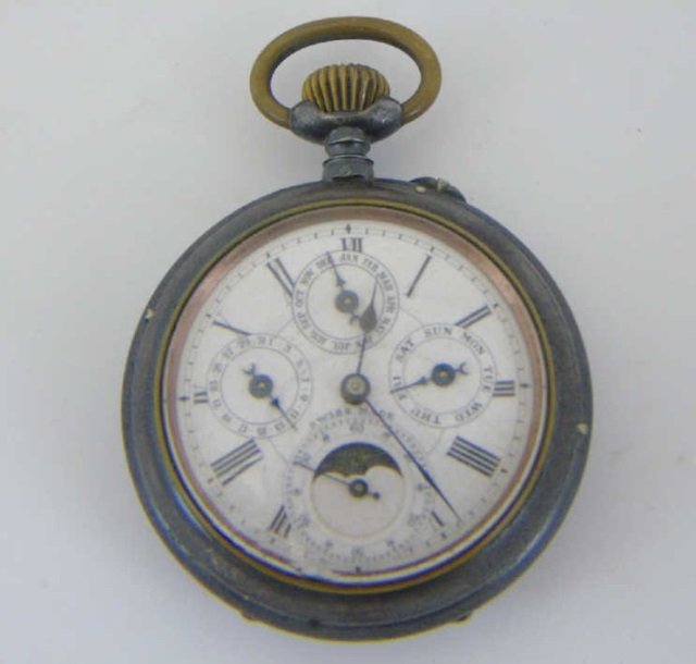 Antique Victorian Swiss Made Silver Pocket Watch: Antique Victorian Swiss Made Silver Pocket Watch. Dials for month, day of month, day of week, hour and minutes. Silver plate. Needs work. Measures 3 inches by 2 inches.