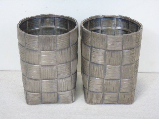 Pair Russian Imperial Silver Trompe L'Oeil Cups: Pair Russian Imperial Silver Trompe L'Oeil Cups. Hand chased to resemble basket weave. Hallmarked for silver, BK. St. Petersburg. Assay mark for Yakov L Yapanov. Each measures 5 inches in height. Weig