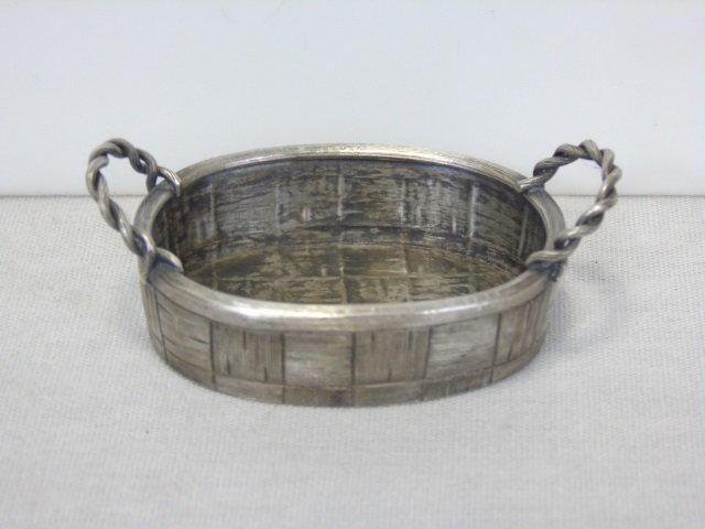 Russian Imperial Silver Trompe L'Oeil Basket: Russian Imperial Silver Trompe L'Oeil Basket. Hand chased to resemble basket weave. Hallmarked for silver, dated 1896, initialed for silversmith. St. Petersburg. Measures 2.5 inches wide. Weighs appro