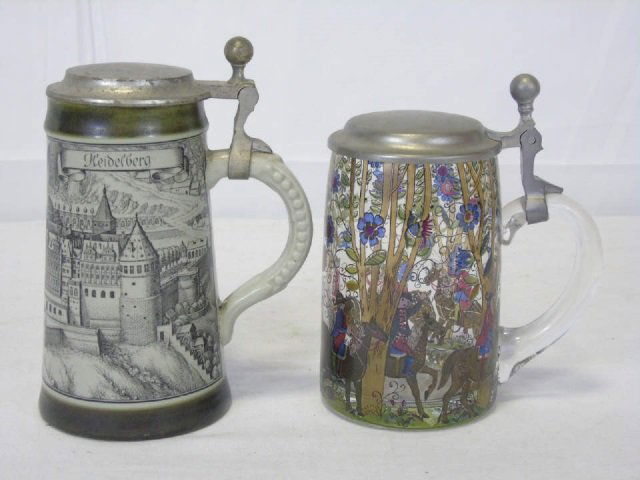 2 Antique German Painted Tankards, Pewter Lids: Lot of two antique German beer tankards with pewter lids. One has a hand painted hunt scene on clear glass. 3 1/2" dia. x 6" H. One is a hand painted scene of Heidelberg on stoneware. 4" dia. x 7" H.