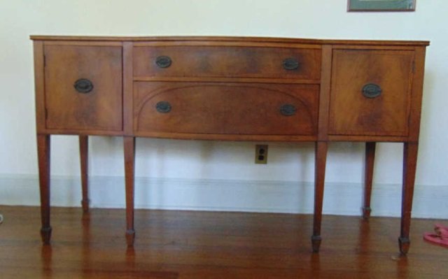 Hepplewhite H. Herrman Bow Front Buffet: Hepplewhite Antique H. Herrman Bow Front Buffet. Label in drawer. Marquetry wood inlay. Tapered legs. Measure 36.5 inches in height, 65 inches in width, 22 inches in depth.