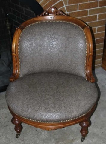 Custom Upholstered 19th C Victorian Slipper Chair: Custom Upholstered 19th C Victorian Slipper Chair. Antique American Victorian slipper chair with carved mahogany legs and casters. Contemporary faux leather upholstery. One of two in this auction. Mea
