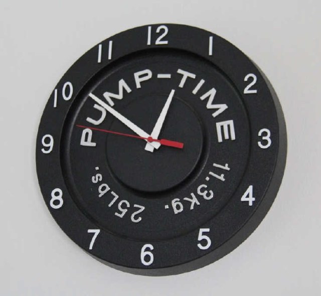 "Pump Time" Weight Lifting Gym Wall Clock: Pump Time Weight Lifting Gym Wall Clock. Measures 11 inches in diameter. From the Greenwich, Connecticut home of interior decorator Catherine Cleare.