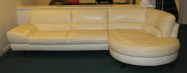 Contemporary Modern Natuzzi Italian Leather Sofa: Contemporary Modern White Leather Sofa. "L" shaped sofa, two pieces. Italian sofa made by Natuzzi. Measures 31 inches in height, 123 inches in width, 38 inches in depth.