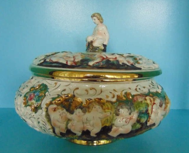 Vintage Italian Capodimonte Tureen w/ Putti: Vintage Italian Capodimonte Tureen w/ Putti. Hand painted porcelain. Measures 9.5 inches in height, 11 inches in diameter. From the Greenwich, Connecticut home of interior decorator Catherine Cleare.