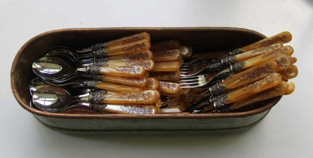 Lot Amber Plastic Handle Spoons, Forks & Knives: Lot of amber colored plastic handle flatware. Service for 12. Knives, teaspoons, soup spoons, salad forks and dinner forks. Made in Italy. Silver plate detail.