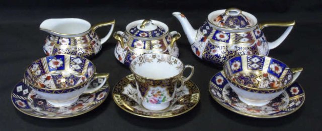 Antique English Mintons Imari Pattern Service: Antique English Mintons Imari Pattern Service. Three cups and saucers, pot, sugar and creamer. Signed on bottoms. Teapot measures 8 1/2" W x 4" H.