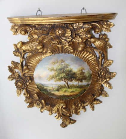 Vintage Hand Carved Hand Painted Wall Bracket: Vintage Hand Carved Hand Painted Wall Bracket. Gilt decorated with central scene painted. Measures 17 inches in height, 10 inches in width, 7 inches in depth. From the Greenwich, Connecticut home of i