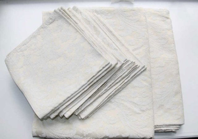Lot 12 Damask Hotel Napkins and Two Tablecloths: Lot 12 Damask Hotel Napkins and Two Tablecloths 2 Tablecloths, 17 napkins 19" x 19". From the Greenwich, Connecticut home of interior decorator Catherine Cleare.
