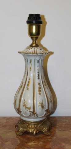 Tiche White & Gold Porcelain Ormolu Base Lamp: White & Gold Porcelain Ormolu Base Lamp by Tiche, Italian fashion lamp maker. Gold lead on white porcelain. Measures 17 inches in height, 5 inches in diameter.