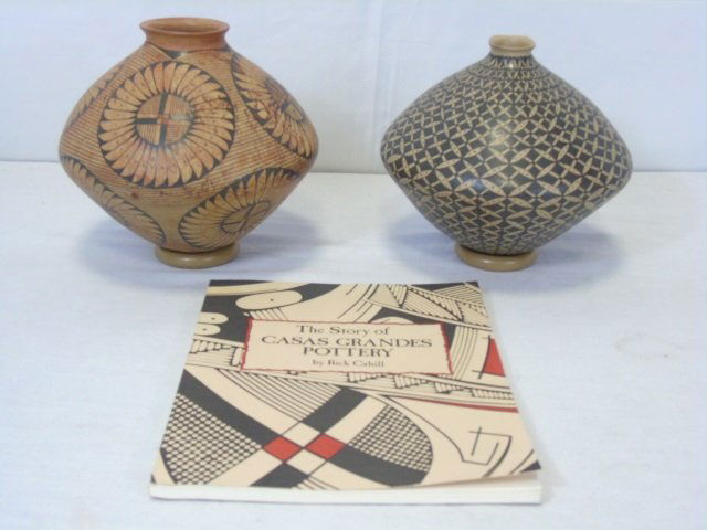 2 Casas Grandes Clay Pottery Earthenware: Two Casas Grandes clay earthenware pottery. Both have round disk stands. Includes book, "The Story of Casas Grandes Pottery", by Rick Cahill. 7 1/2" dia. x7 1/2" H and 8" dia. x 8" H.