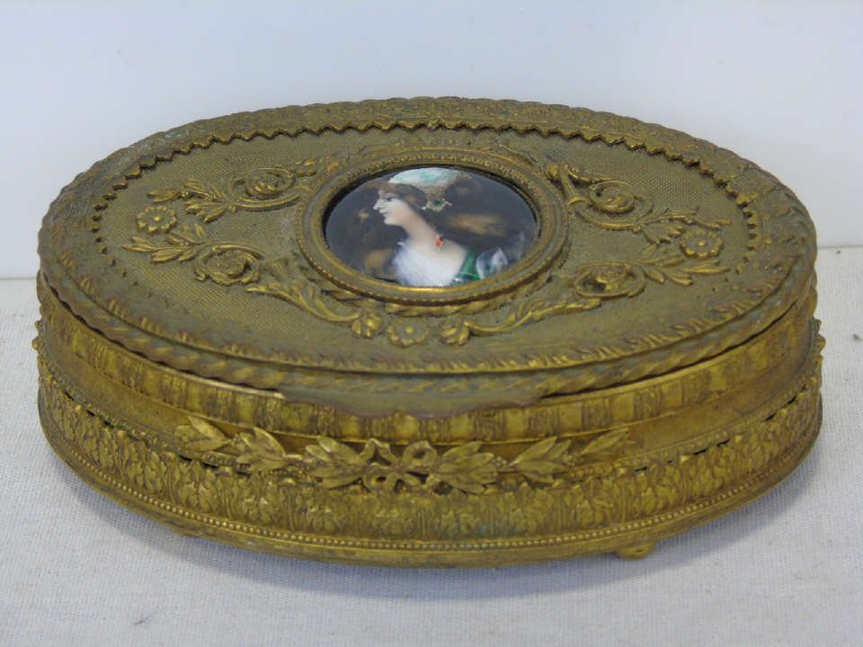 Antique French Gilt Ormolu Box w/ Limoges Enamel: Antique French Gilt Ormolu Box w/ Limoges Enamel Portrait Miniature Plaque. Showing a young girl in the Pre-Raphaelite style. Hand painted enamel plaque initialed L.C. Velvet lined. Measures 5 by 3.5 